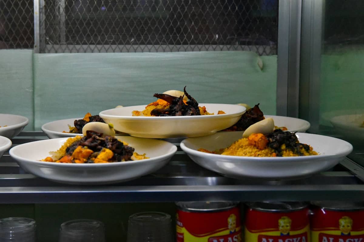For 80 years, Pastora’s Palabok, also known as Boet and Mayer, has drawn diners from across different cities to Quiapo, Manila, for its signature pancit palabok.
The dish is coated in a rich, flavorful sauce mixed with shrimp and pork, and topped with tofu, chicharon bits, boiled egg, and squid. A regular serving costs ₱90, while the ₱120 serving comes with additional toppings. | Zedrich Xylak Madrid