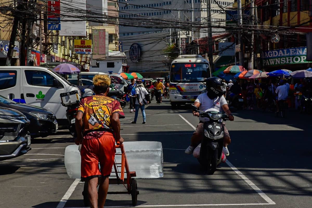 A man is seen pushing a cart carrying a block of ice in Quiapo, Manila, on 18 July.
Workers of the country rely on physically demanding work to earn a living amid limited access to stable and secure employment. l Zedrich Xylak Madrid