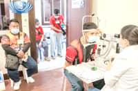 VOLUNTEER firefighters undergo checkup at the Tzu Chi Eye Center.