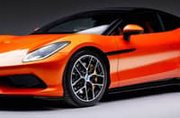 FINISHED in orange, the DENZA Z pairs low-slung supercar proportions with functional aerodynamic details.
