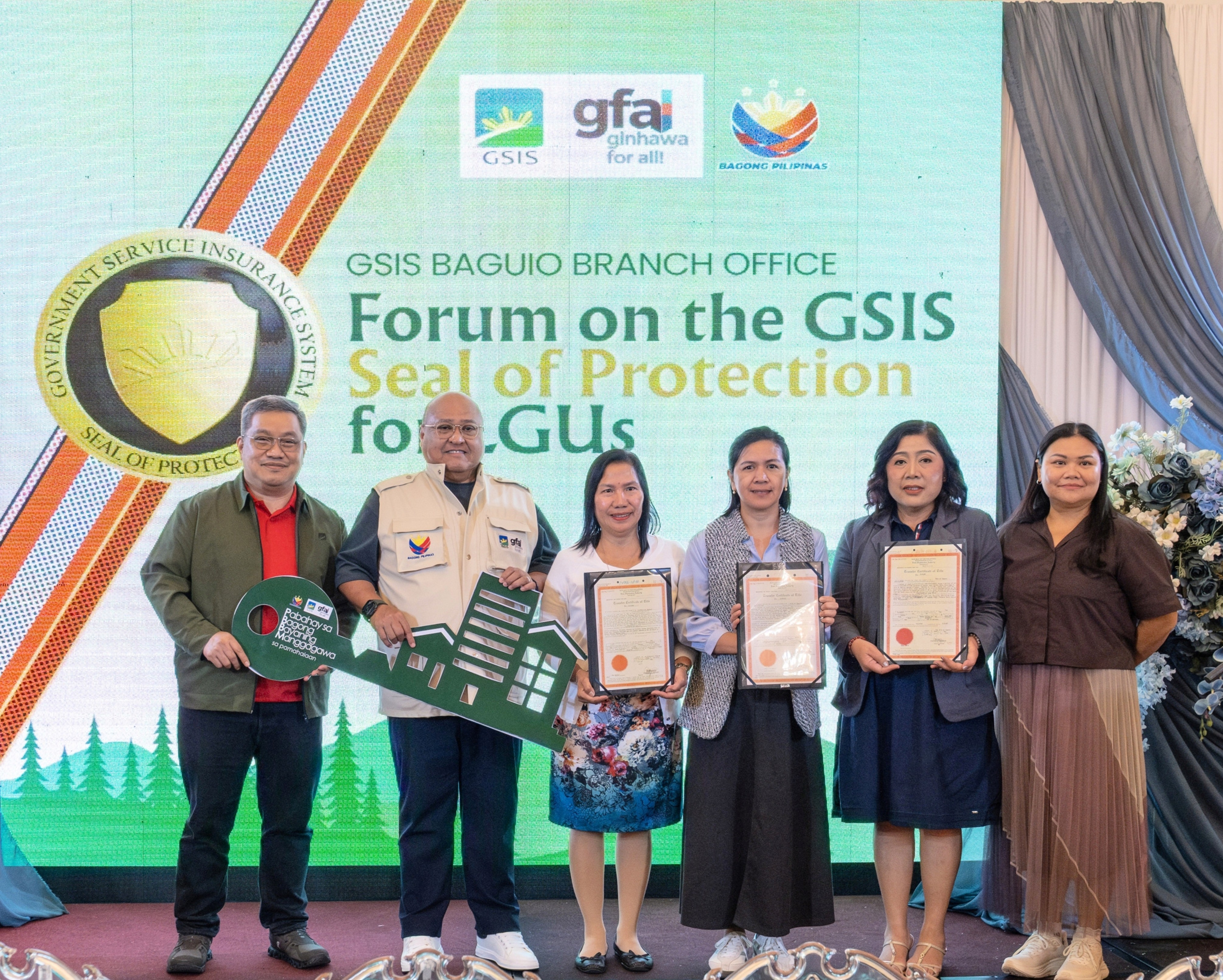 GSIS awards land titles to 3 government workers in Baguio