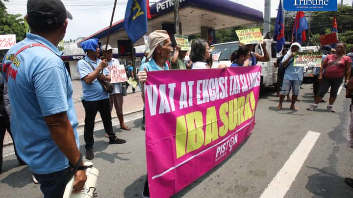 OIL PRICE PROTEST
Members of transport group Piston stage a protest outside a Petron gas station along East Avenue in Quezon City on Tuesday, July 21, 2026, opposing the latest round of big-time fuel price hikes. Photo by Analy Labor