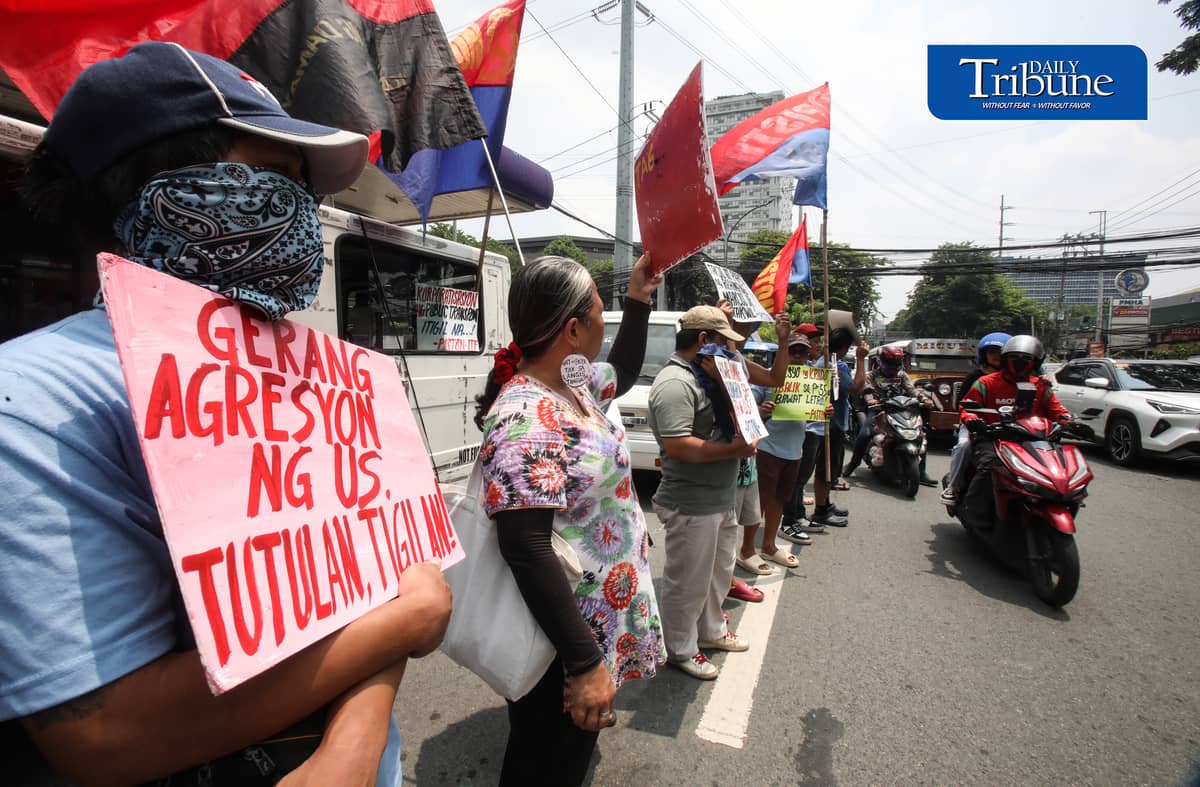 OIL PRICE PROTEST
Members of transport group Piston stage a protest outside a Petron gas station along East Avenue in Quezon City on Tuesday, July 21, 2026, opposing the latest round of big-time fuel price hikes. Photo by Analy Labor