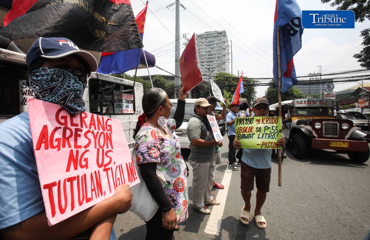 OIL PRICE PROTEST
Members of transport group Piston stage a protest outside a Petron gas station along East Avenue in Quezon City on Tuesday, July 21, 2026, opposing the latest round of big-time fuel price hikes. Photo by Analy Labor
