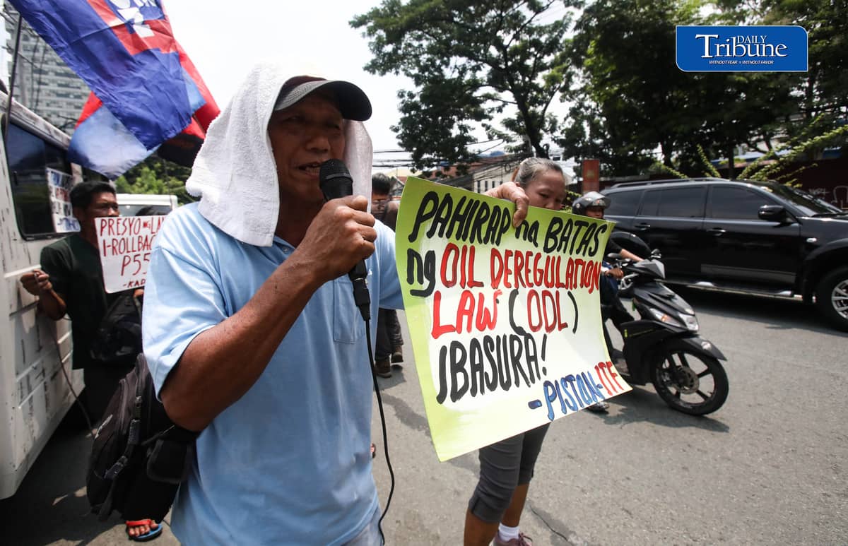 OIL PRICE PROTEST
Members of transport group Piston stage a protest outside a Petron gas station along East Avenue in Quezon City on Tuesday, July 21, 2026, opposing the latest round of big-time fuel price hikes. Photo by Analy Labor