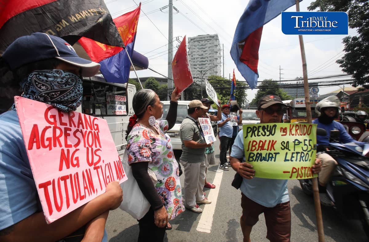 OIL PRICE PROTEST
Members of transport group Piston stage a protest outside a Petron gas station along East Avenue in Quezon City on Tuesday, July 21, 2026, opposing the latest round of big-time fuel price hikes. Photo by Analy Labor