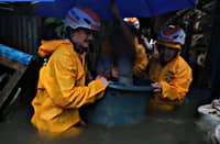 Preemptive Evacuation — Families from flood-prone barangays evacuate to safer locations as authorities respond to the threat of rising waters brought by enhanced habagat