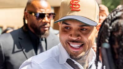 US singer Chris Brown departs after attending a hearing at Southwark Crown Court in London on July 24, 2026. Brown on July 24, 2026, pleaded guilty to a public order offence following an alleged brawl at a London nightclub in 2023. "Guilty," replied Brown, 37, dressed in a beige suit and dark tie, after the charge of affray was put to him as he stood in the dock at Southwark Crown Court in London.