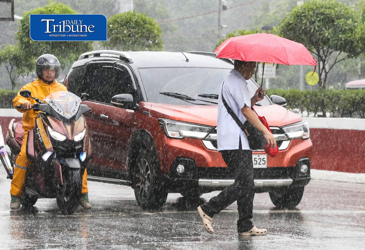 (July 25 2026) Pedestrians use umbrellas when suddenly heavy downpour in Quezon City on Saturday July 26 2026. PAGASA said light to moderate with occasional heavy rains affecting Metro Manila enhanced by southwest monsoon. Photo/Analy Labor