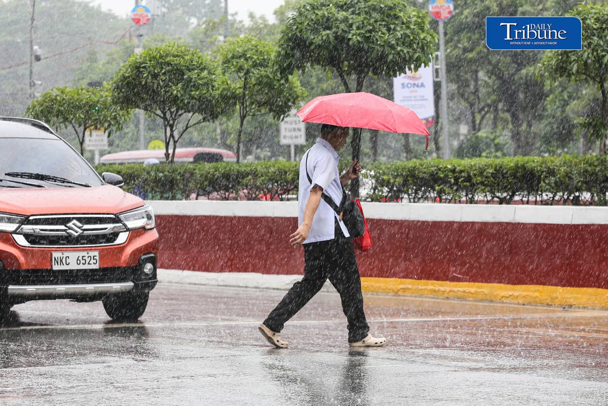 (July 25 2026) Pedestrians use umbrellas when suddenly heavy downpour in Quezon City on Saturday July 26 2026. PAGASA said light to moderate with occasional heavy rains affecting Metro Manila enhanced by southwest monsoon. Photo/Analy Labor
