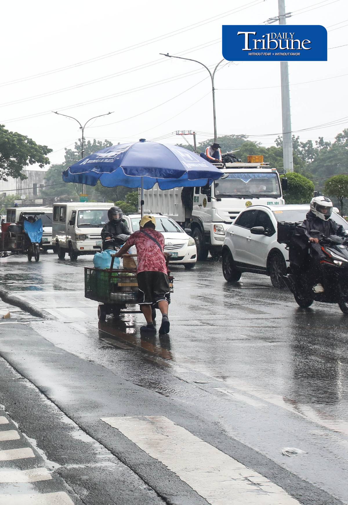(July 25 2026) Pedestrians use umbrellas when suddenly heavy downpour in Quezon City on Saturday July 26 2026. PAGASA said light to moderate with occasional heavy rains affecting Metro Manila enhanced by southwest monsoon. Photo/Analy Labor