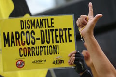 Members of ATOM stage a protest in Makati