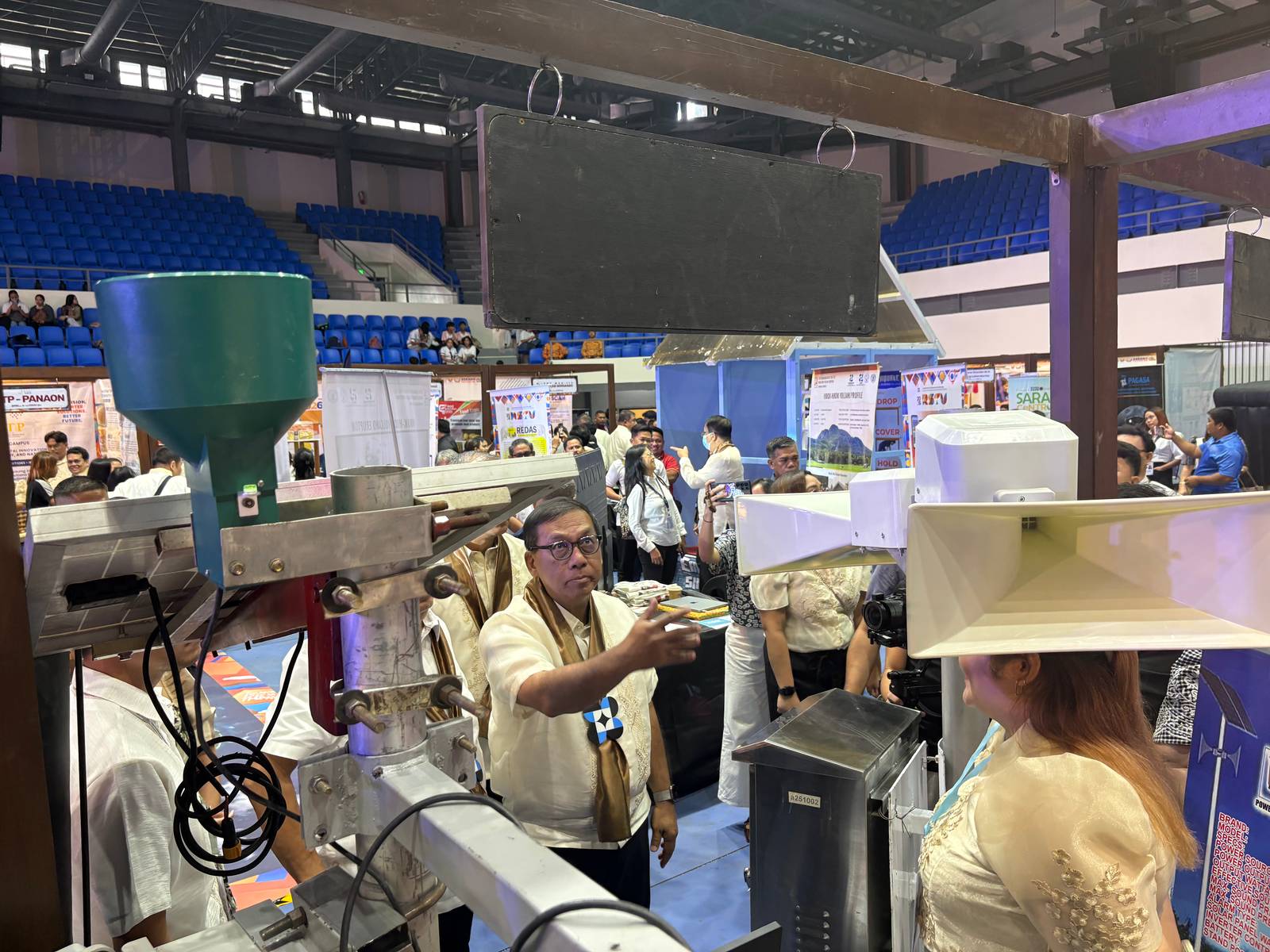 Department of Science and Technology Secretary Renato U. Solidum Jr. inspects local research and technology exhibits during the ceremonial tour of the 2026 Regional Science, Technology and Innovation Week.