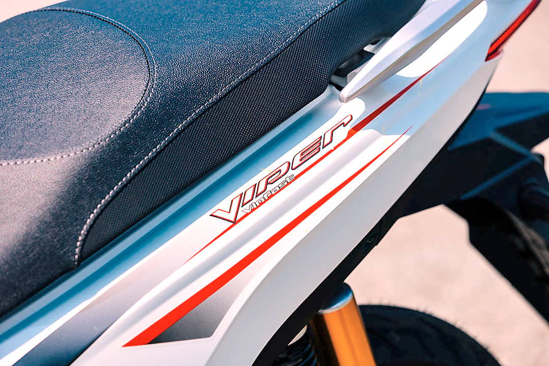 VIPER graphics add red accents to the electric scooter’s side panel beneath its two-person seat.