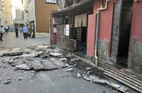 THE exterior wall of a shop is seen collapsed in an earthquake, in Kumamoto City on 28 July 2026.