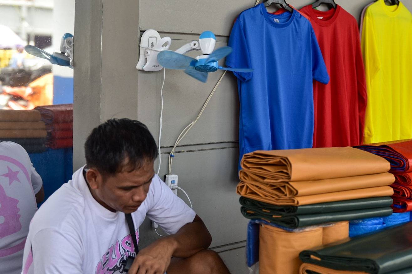 Vendors in Divosoria, Manila are seen resting with energy saving clip on fans today, July 28.

As per Marcos Jr's seeks to ammend the EPIRA and remove system loss from consumer's power bill. l Zedrich Xylak Madrid