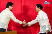 House Speaker Faustino "Bojie" Dy (left) shook hands with President Ferdinand Marcos Jr. (right) ahead of the latter's State of the Nation Address on 25 July 2026.