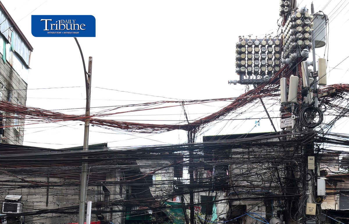 (July 30 2026) Tangled wires known as Spaghetti wires are seen hanging along E. Rodriguez Avenue in Quezon City on Thursday July 30 2026. The recent SONA of President Ferdinand Marcos Jr., called for an end to consumer-paid electricity system losses through amendments to the Electric Power Industry Reform Act (EPIRA) of 2001. The Department of Energy (DOE) said the government may need about a year to fully remove the system-loss charge from consumers’ electricity bills, with Energy Secretary Sharon Garin saying the policy could be fully implemented by 2027. Photo/Analy Labor