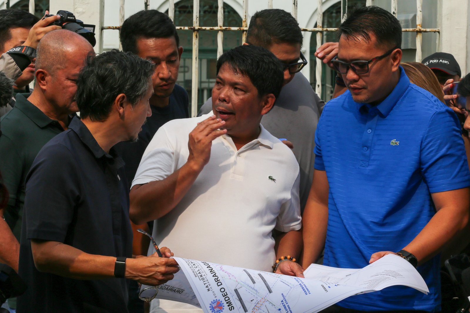 Department of Public Works and Highways personnel remove silt and debris from a drainage system along Taft Avenue in Ermita, Manila on the morning of 31 July 2026 as Secretary Vince Dizon inspects the proposed drainage rehabilitation project. The inspection is part of a series of site visits to ensure that critical flood control projects are progressing to help protect communities in flood-prone areas.