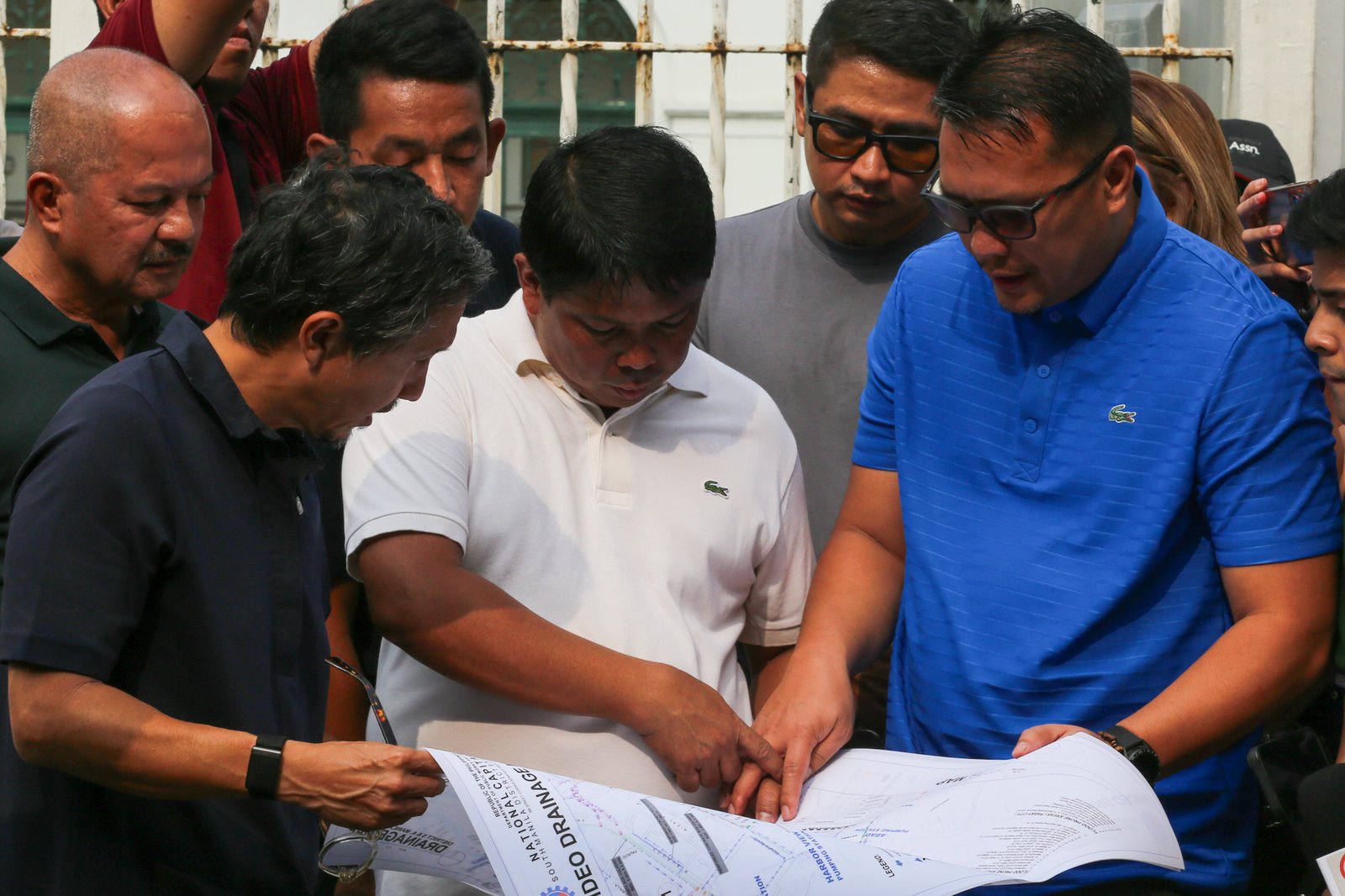 Department of Public Works and Highways personnel remove silt and debris from a drainage system along Taft Avenue in Ermita, Manila on the morning of 31 July 2026 as Secretary Vince Dizon inspects the proposed drainage rehabilitation project. The inspection is part of a series of site visits to ensure that critical flood control projects are progressing to help protect communities in flood-prone areas.