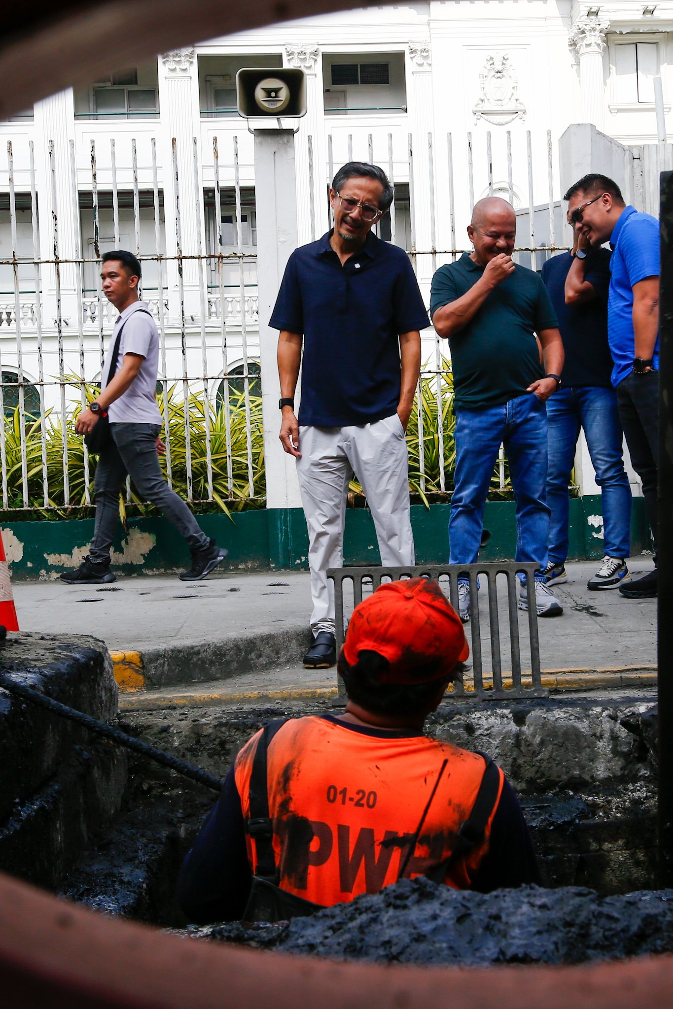 Department of Public Works and Highways personnel remove silt and debris from a drainage system along Taft Avenue in Ermita, Manila on the morning of 31 July 2026 as Secretary Vince Dizon inspects the proposed drainage rehabilitation project. The inspection is part of a series of site visits to ensure that critical flood control projects are progressing to help protect communities in flood-prone areas.
