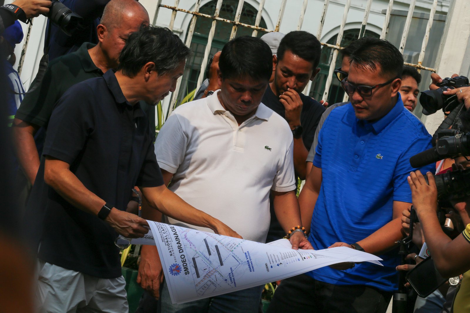 Department of Public Works and Highways personnel remove silt and debris from a drainage system along Taft Avenue in Ermita, Manila on the morning of 31 July 2026 as Secretary Vince Dizon inspects the proposed drainage rehabilitation project. The inspection is part of a series of site visits to ensure that critical flood control projects are progressing to help protect communities in flood-prone areas.