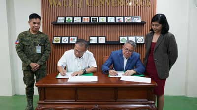 BRIG. Gen. Marces T. Gayat (left), commander of the Civil Military Operations Regiment, and Capt. Paul J. Gayanilo (right), vice president for Facility Security of Solaire Entertainment City, sign the deed of donation during the turnover ceremony at the CMOR's Kaamulan Hall in Fort Bonifacio, Taguig City.