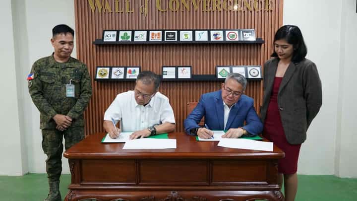 BRIG. Gen. Marces T. Gayat (left), commander of the Civil Military Operations Regiment, and Capt. Paul J. Gayanilo (right), vice president for Facility Security of Solaire Entertainment City, sign the deed of donation during the turnover ceremony at the CMOR's Kaamulan Hall in Fort Bonifacio, Taguig City.