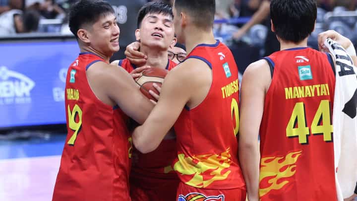 ADRIAN Nocum gets a hug from his teammates after sinking the game-winning basket in Rain or Shine’s 98-97 win over Magnolia in the PBA Season 50 Governors’ Cup last night at the Mall of Asia Arena.