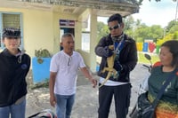 Rare monitor lizard rescued from children’s clutches
