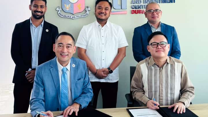 TRADE Commissioner Vichael Angelo D. Roaring (seated, right), head of the Philippine Trade and Investment Center in Dubai, and Aurelio III Suzara German (seated, left), managing director of The Hub Trading and Logistic Services LLC SP, sign the agreement launching Project CocoBridge, an initiative aimed at expanding Philippine coconut exports across the Gulf Cooperation Council region.