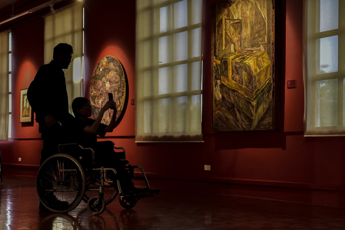 Visitors explore historic artworks at the National Museum of Fine Arts