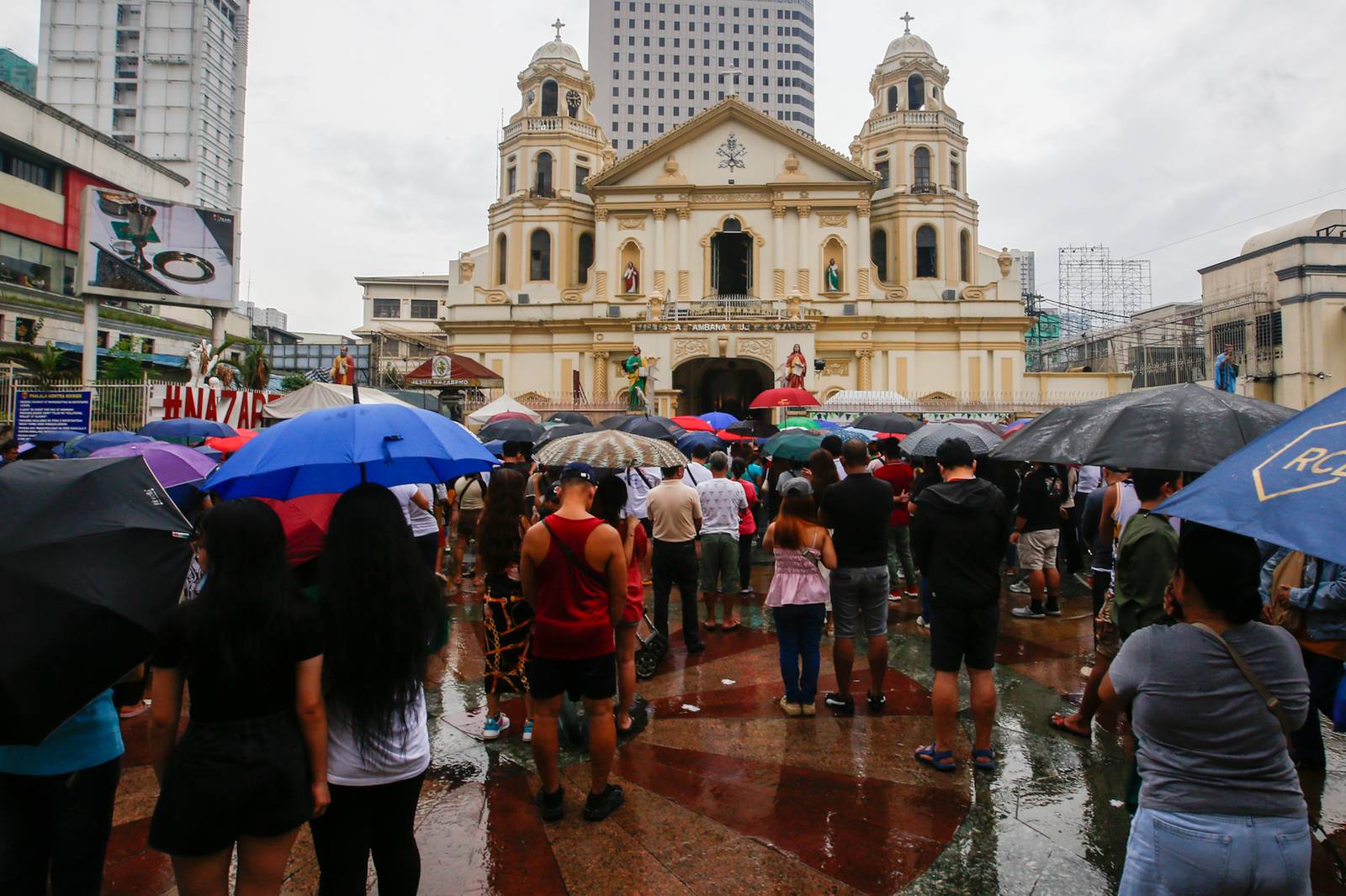 Catholic devotees attend the First Sunday Mass on 2 August 2026 at the Minor Basilica and National Shrine of Jesus Nazareno despite slight rain showers brought by localized thunderstorms.