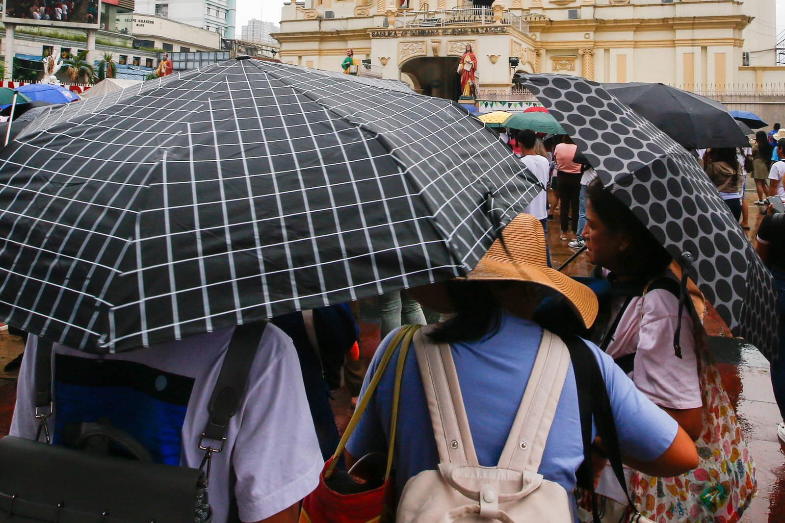 Catholic devotees attend the First Sunday Mass on 2 August 2026 at the Minor Basilica and National Shrine of Jesus Nazareno despite slight rain showers brought by localized thunderstorms.