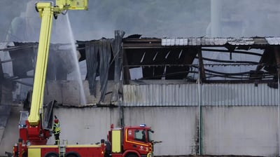 Industrial waste fire confines 
30,000 indoors