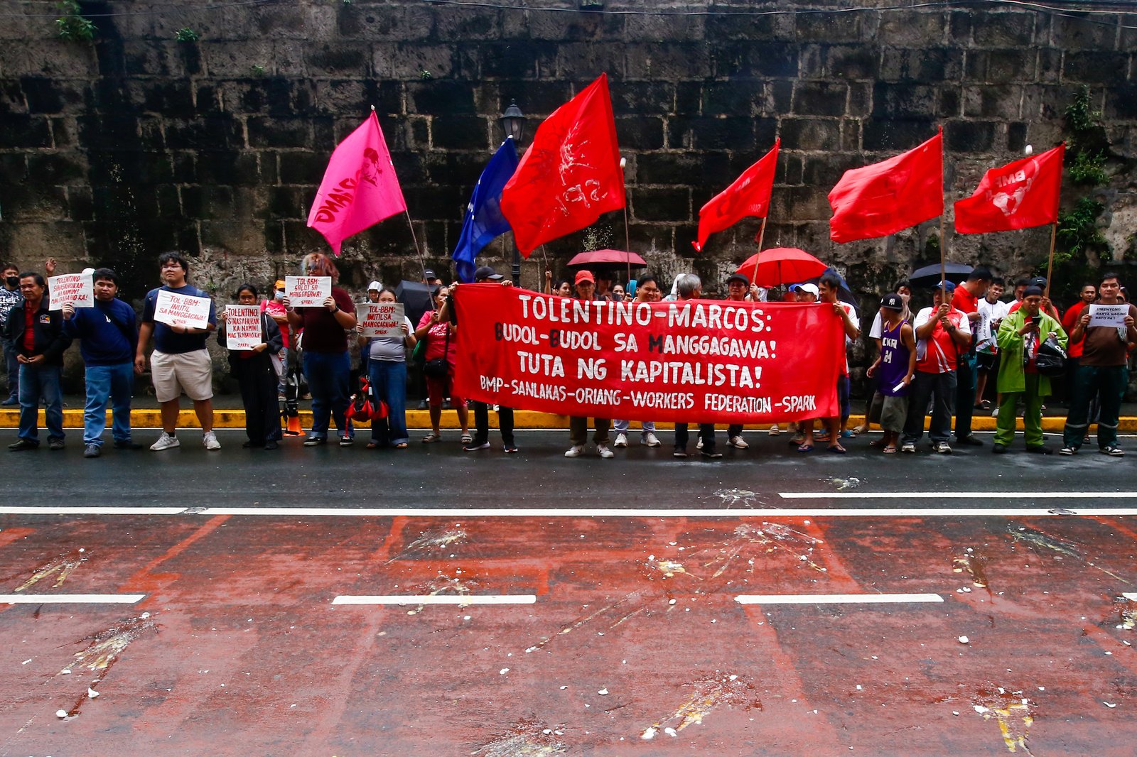 Workers stage a lightning rally on Monday, 3 August 2026, outside the Department of Labor and Employment (DOLE) Central Office, slamming the suspension of the ₱85 daily wage hike in Metro Manila