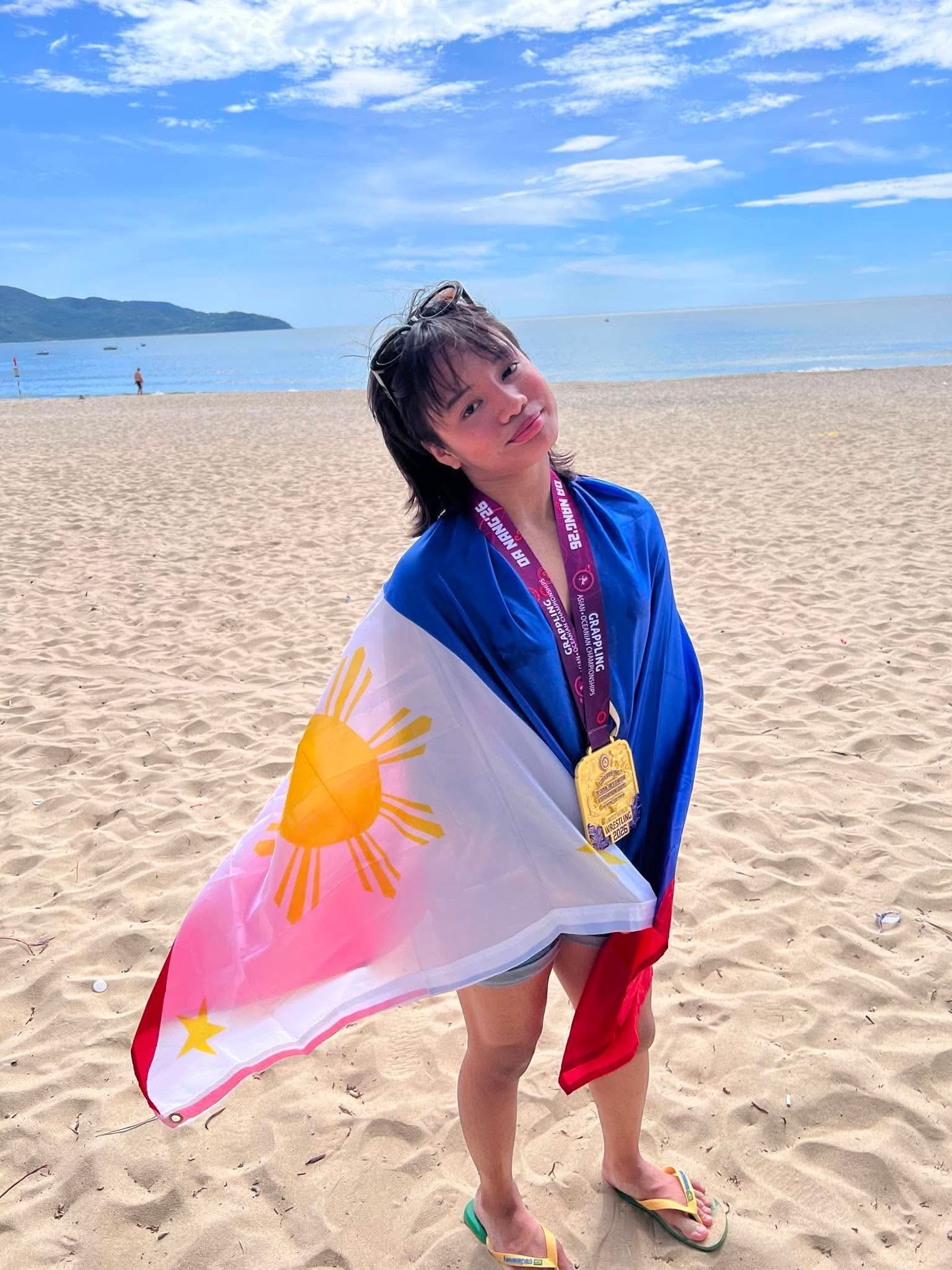 YANI Alexii Lopez savors the sweetness of her victory after winning a gold medal in the 2026 United World Wrestling Asian & Oceania Grappling Championships in Da Nang, Vietnam.