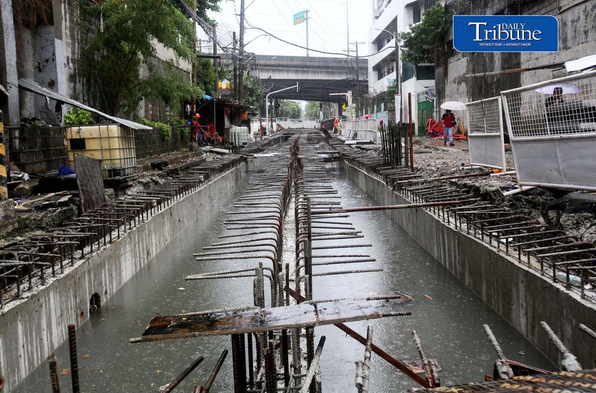 (August 04 2026) Rain or shine workers continued working at the Quezon City local government project a Water Detention Basin along Maria Clara street corner Araneta Avenue in Quezon City on Tuesday August 5 2026. The Quezon City LGU project is to reduce flooding in the area. Photo/Analy Labor
