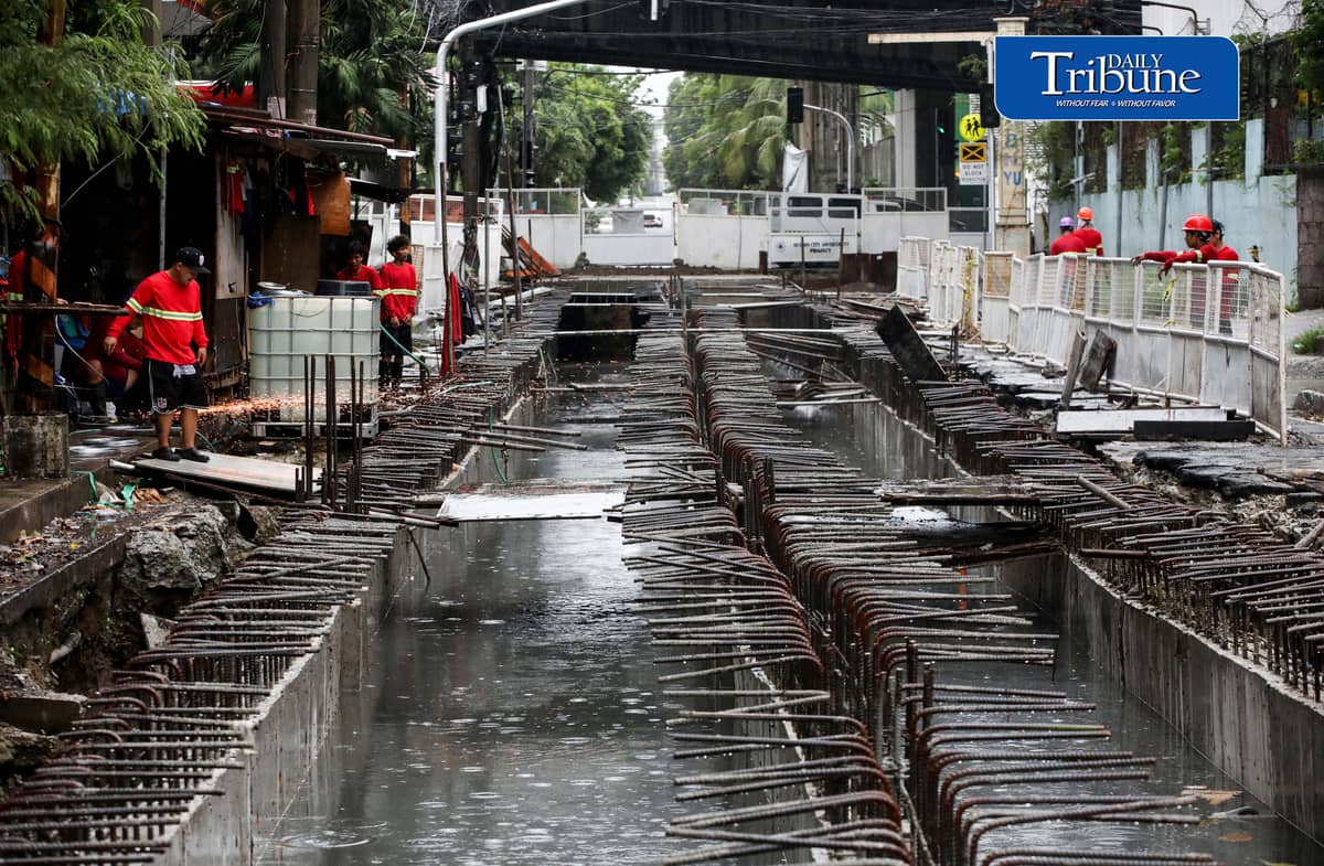 (August 04 2026) Rain or shine workers continued working at the Quezon City local government project a Water Detention Basin along Maria Clara street corner Araneta Avenue in Quezon City on Tuesday August 5 2026. The Quezon City LGU project is to reduce flooding in the area. Photo/Analy Labor