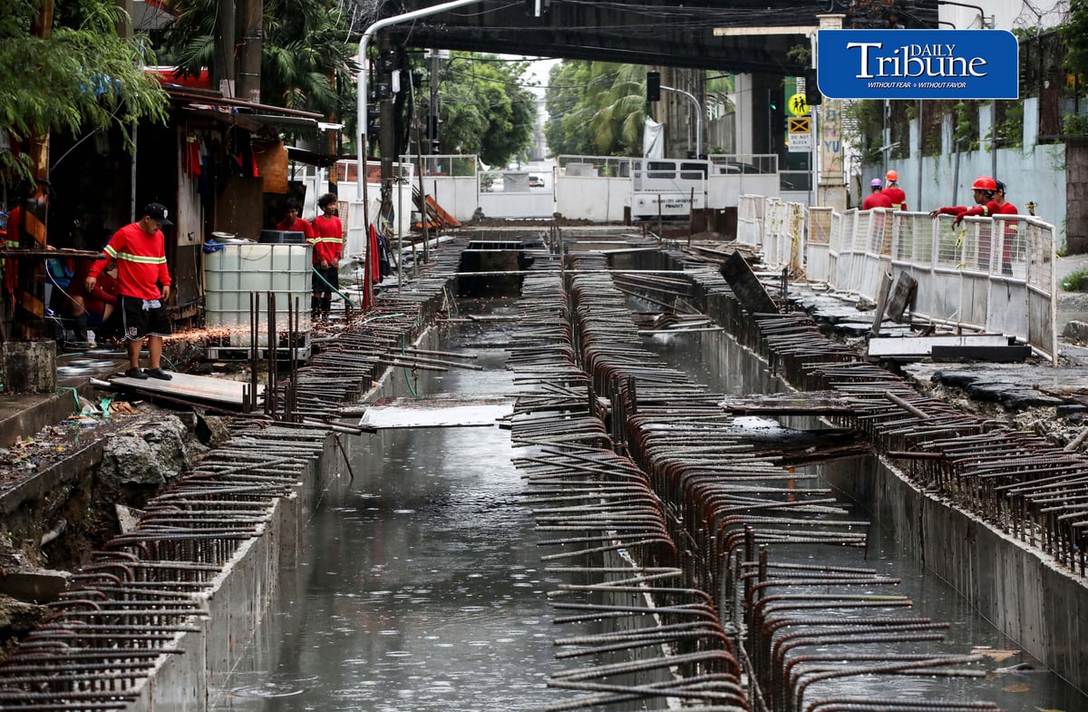 (August 04 2026) Rain or shine workers continued working at the Quezon City local government project a Water Detention Basin along Maria Clara street corner Araneta Avenue in Quezon City on Tuesday August 5 2026. The Quezon City LGU project is to reduce flooding in the area. Photo/Analy Labor