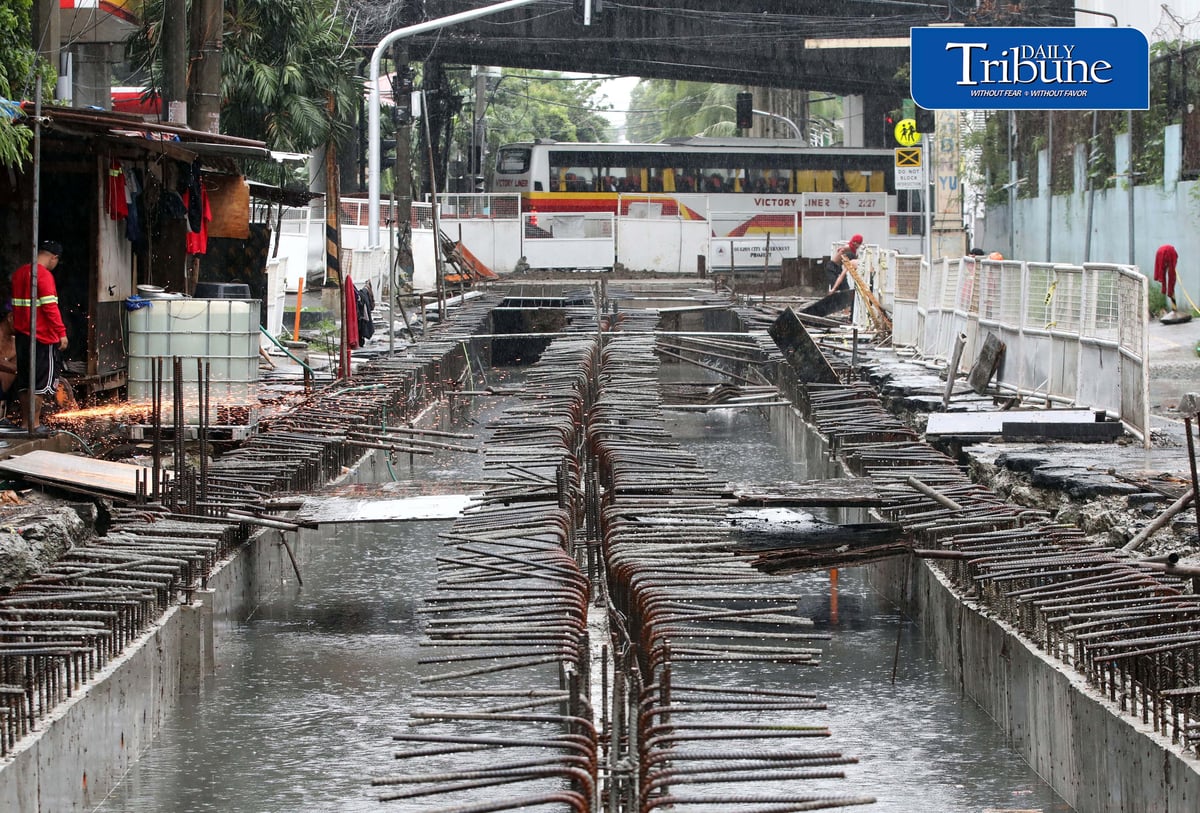 (August 04 2026) Rain or shine workers continued working at the Quezon City local government project a Water Detention Basin along Maria Clara street corner Araneta Avenue in Quezon City on Tuesday August 5 2026. The Quezon City LGU project is to reduce flooding in the area. Photo/Analy Labor