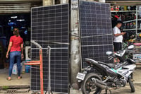 Solar panels and inverters at Raon St. in Quiapo, Manila