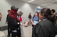 INJURED Filipino seafarers from the Panama-flagged tanker M/T Gas Lisbon are welcomed by officials from the Department of Migrant Workers and Overseas Workers Welfare Administration representatives upon their arrival at Ninoy Aquino International Airport Terminal 3 in Manila.