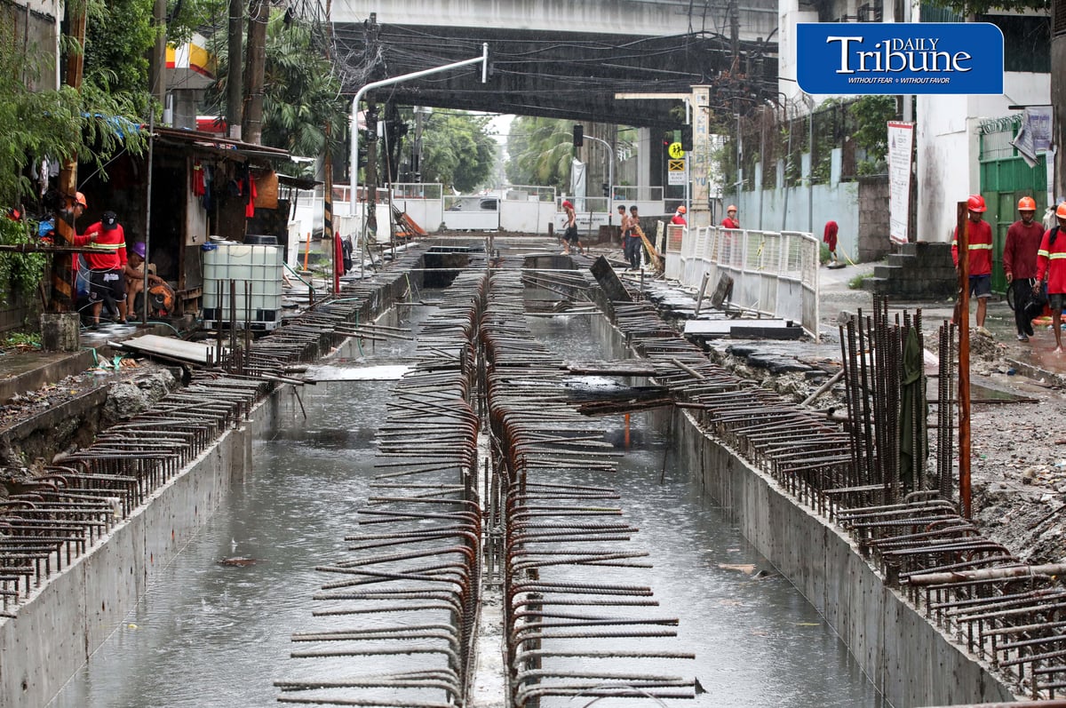 (August 04 2026) Rain or shine workers continued working at the Quezon City local government project a Water Detention Basin along Maria Clara street corner Araneta Avenue in Quezon City on Tuesday August 5 2026. The Quezon City LGU project is to reduce flooding in the area. Photo/Analy Labor