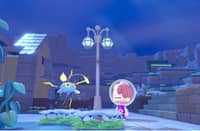 A player character stands in the underwater town of Bubbly Basin alongside a Chinchou in Pokémon Pokopia.
