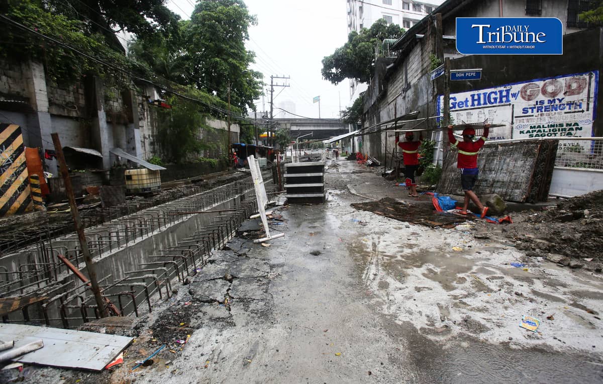 (August 04 2026) Rain or shine workers continued working at the Quezon City local government project a Water Detention Basin along Maria Clara street corner Araneta Avenue in Quezon City on Tuesday August 5 2026. The Quezon City LGU project is to reduce flooding in the area. Photo/Analy Labor