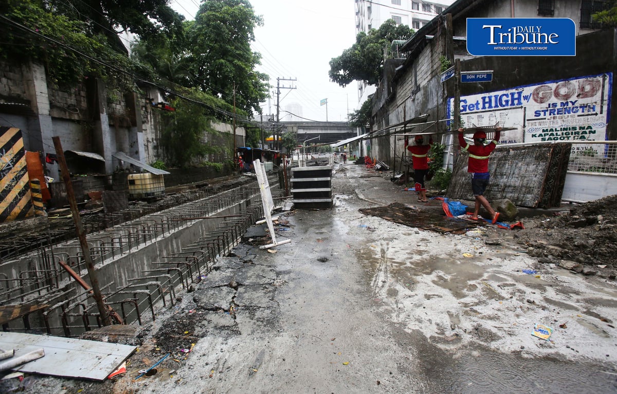 (August 04 2026) Rain or shine workers continued working at the Quezon City local government project a Water Detention Basin along Maria Clara street corner Araneta Avenue in Quezon City on Tuesday August 5 2026. The Quezon City LGU project is to reduce flooding in the area. Photo/Analy Labor