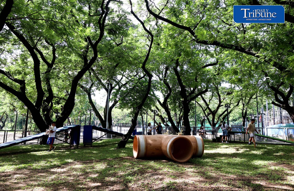 (August 04 2026) Fur parents with their pet dogs enjoy the newly opened dog park for parkgoers and their pets at the Quezon Memorial Circle on Saturday August 1 2026. The dog park has play areas and obstacles, such as an open tunnel and agility A-frames, so the furbabies may enjoy, It also has litter bins to keep the park clean, and benches for pet owners to sit on and relax. Photo/Analy Labor