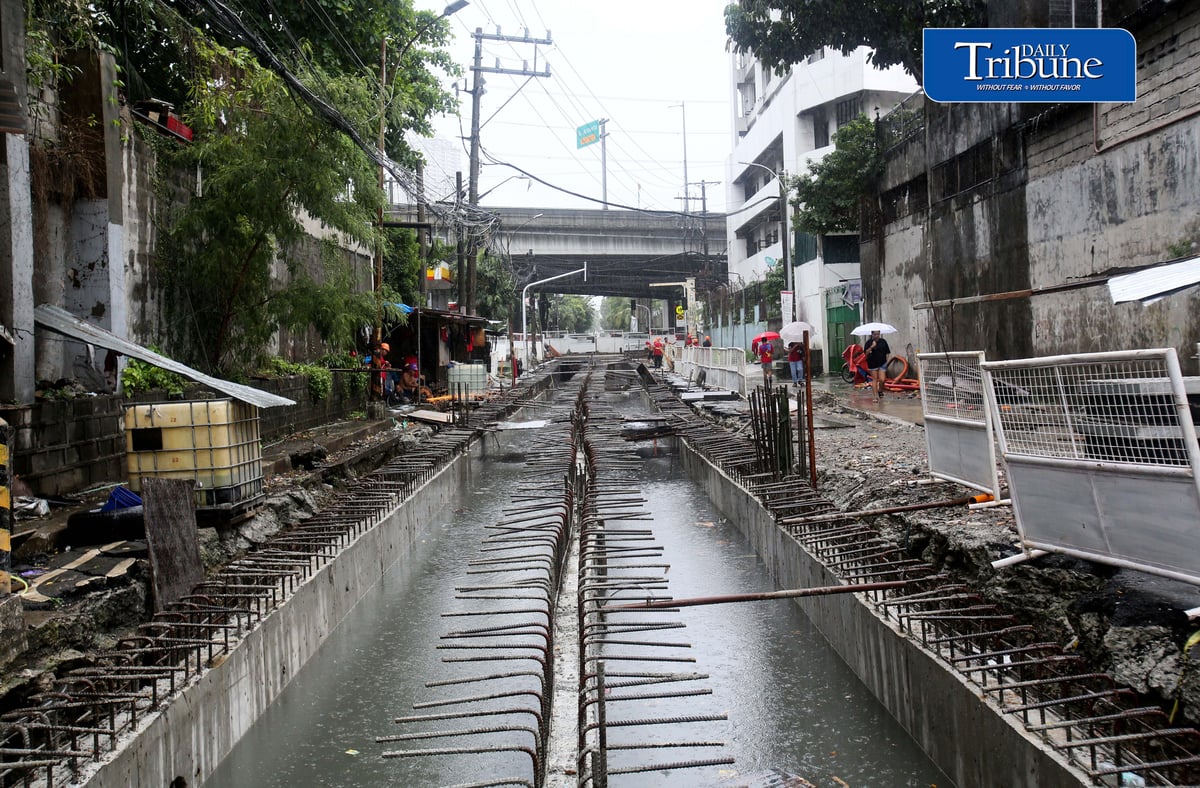(August 04 2026) Rain or shine workers continued working at the Quezon City local government project a Water Detention Basin along Maria Clara street corner Araneta Avenue in Quezon City on Tuesday August 5 2026. The Quezon City LGU project is to reduce flooding in the area. Photo/Analy Labor
