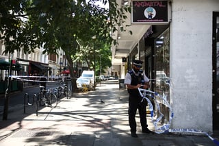 Woman arrested after four men attacked in central London